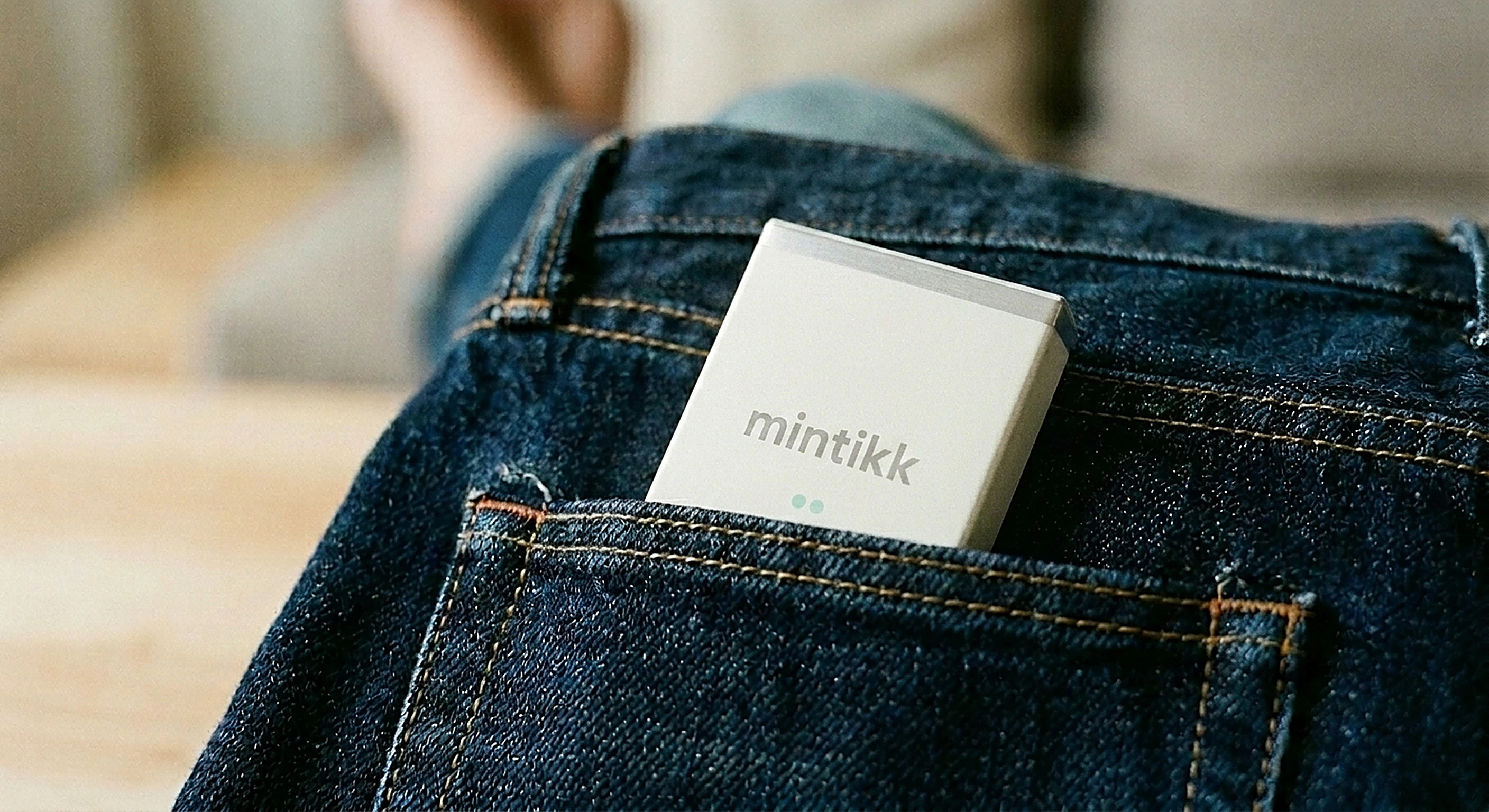 mintikk box half-emerging from the back pocket of indigo denim