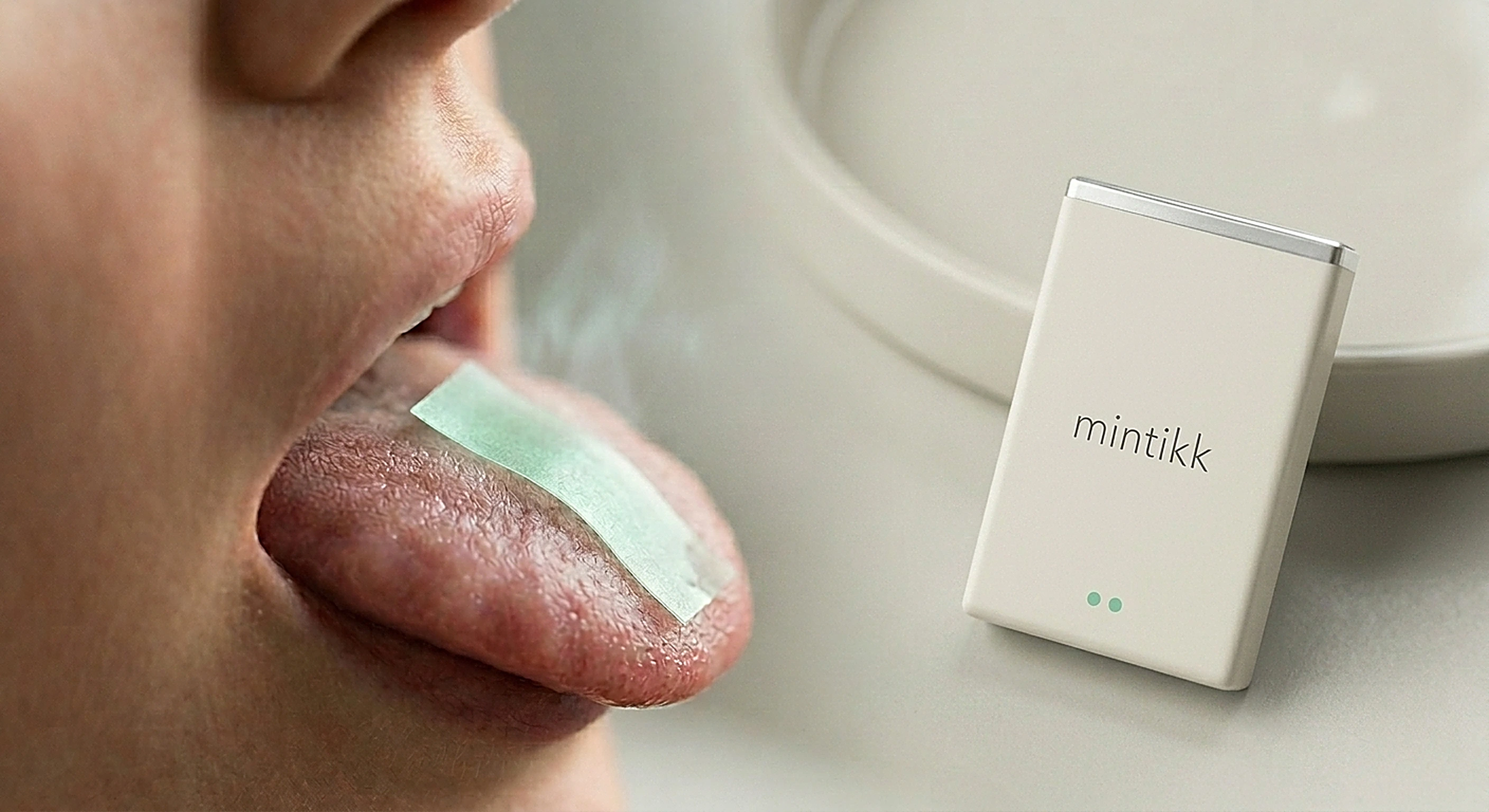 translucent mint strip dissolving on a tongue